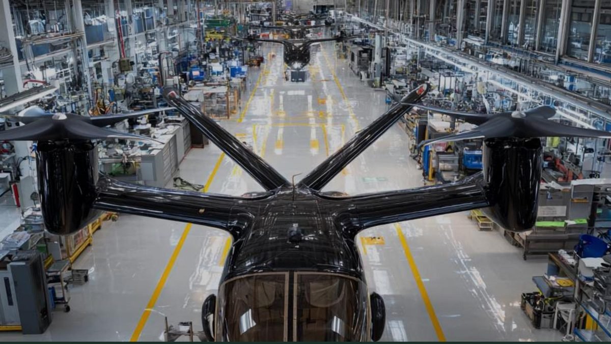 eVTOL aircraft on an assembly floor inside an aerospace manufacturing facility